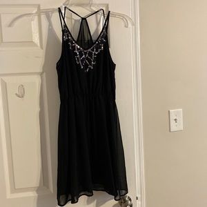 Star Style little black strappy dress
